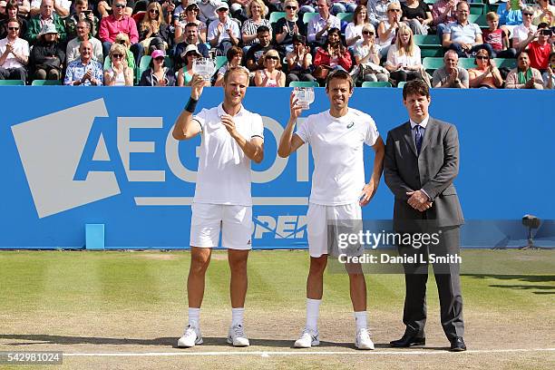 Dominic Inglot of Great Britain and Daniel Nestor of Canada pose for their photograph with Nick Dixon after winning in the men's doubles finals...