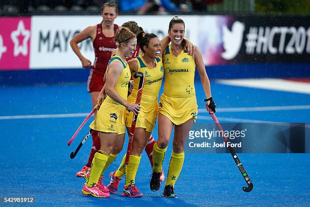 Georgie Parker of Australia is congratulated by teammates Georgia Nanscawen and Grace Stewart after scoring a goal during the FIH Women's Hockey...