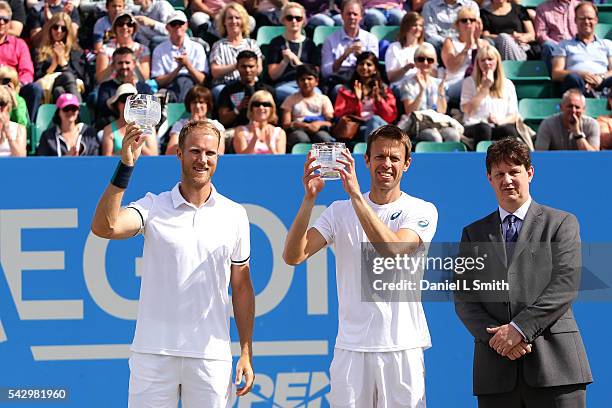 Dominic Inglot of Great Britain and Daniel Nestor of Canada pose for their photograph with Nick Dixon after winning in the men's doubles finals...