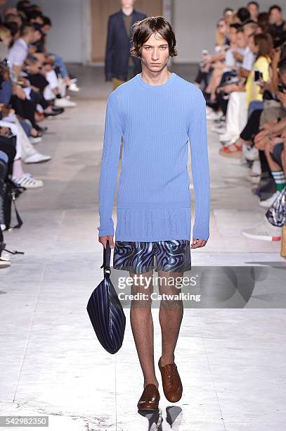 Model walks the runway at the Wooyoungmi Spring Summer 2017 fashion show during Paris Menswear Fashion Week on June 25, 2016 in Paris, France.