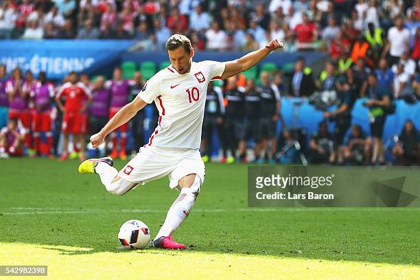Grzegorz Krychowiak of Poland scores at the penalty shootout to win the game during the UEFA EURO 2016 round of 16 match between Switzerland and...