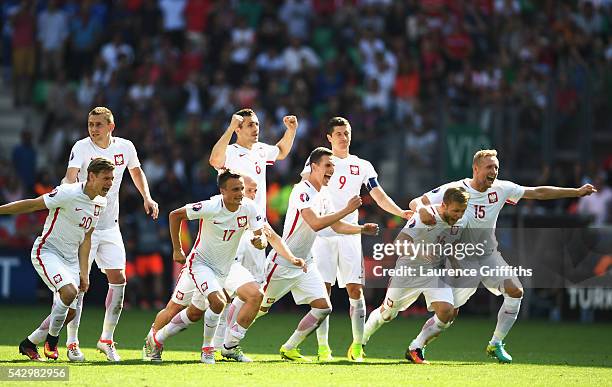 Poland players dash to celebrate as Grzegorz Krychowiak scores the penalty to win the game durign the UEFA EURO 2016 round of 16 match between...