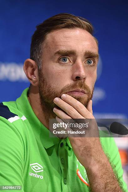 In this handout image provided by UEFA, Richard Keogh of Republic of Ireland faces the media during the Republic of Ireland press conference on June...