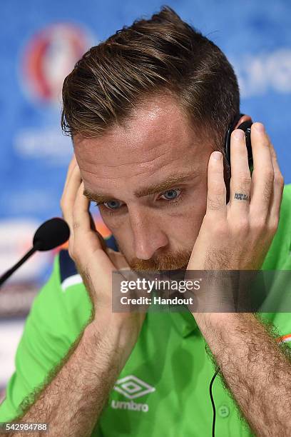 In this handout image provided by UEFA, Richard Keogh of Republic of Ireland faces the media during the Republic of Ireland press conference on June...