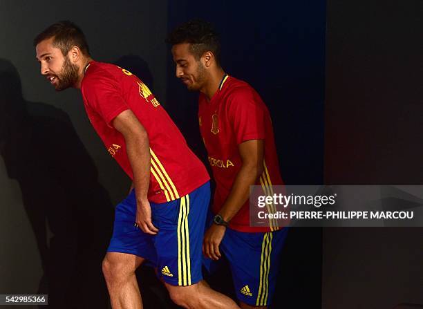 Spain's defender Jordi Alba and Spain's midfielder Thiago Alcantara arrive to hold a press conference at Saint-Martin-de-Re's stadium on June 25,...