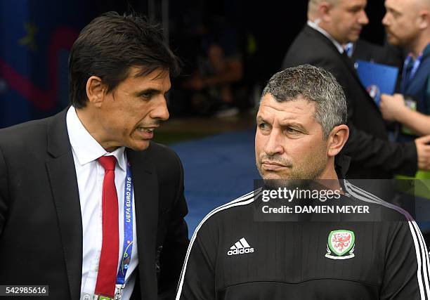 Wales' assistant coach Osian Roberts has a word at the start of the Euro 2016 round of sixteen football match Wales vs Northern Ireland, on June 25,...