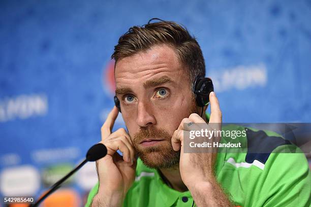 In this handout image provided by UEFA, Richard Keogh of Republic of Ireland faces the media during the Republic of Ireland press conference on June...