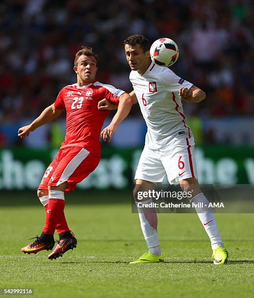 Xherdan Shaqiri of Switzerland and Tomasz Jodlowiec of Poland during the UEFA EURO 2016 Round of 16 match between Switzerland v Poland at Stade...