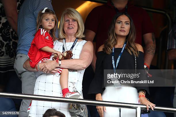 Gareth Bale's mother Deborah Bale holds grand-daughter Alba Bale in her arms as girlfriend Emma-Rhys Jones looks on during the UEFA Euro 2016 Round...