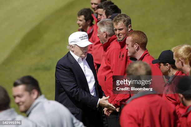 Donald Trump, presumptive Republican presidential nominee, greets supporters as he arrives at Trump International Golf Links in Aberdeen, U.K, on...