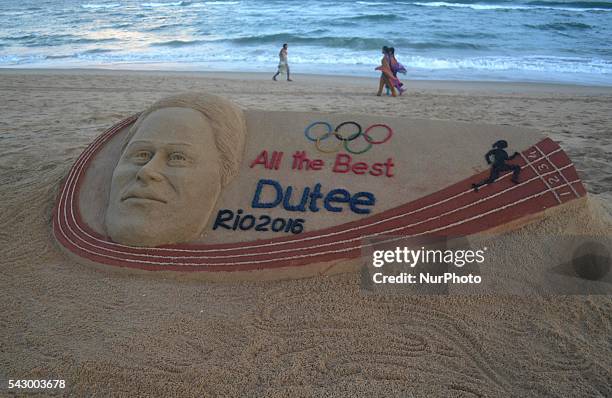 Indian athelet Dutee Chand's sand sclupture looks on the beach of the eastern coast of the Bay of Bengal Sea, creating by sand artist Sudarshan...