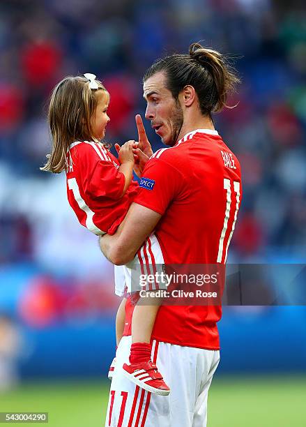 Gareth Bale of Wales celebrates his team's win with his daughter Alba Violet after the UEFA EURO 2016 round of 16 match between Wales and Northern...