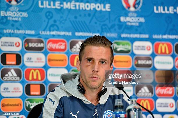 In this handout image provided by UEFA Slovakia defender Peter Pekarik addresses the press before the EURO 2016 1/8th final match between Slovakia...