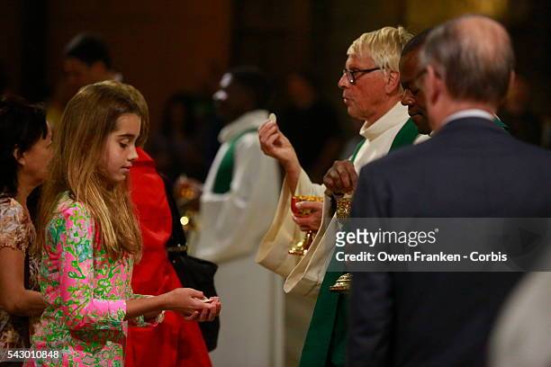 Natalie Biden takes communion as she attends mass with her grandmother Second lady Dr. Jill Biden at Notre-Dame Cathedral on June 12, 2016 in Paris,...
