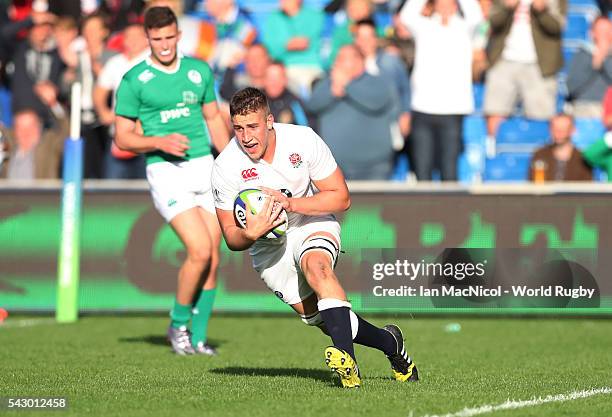 Huw Taylor of England scores a try during the final match against Ireland at AJ Bell Stadium on June 25, 2016 in Salford, England.