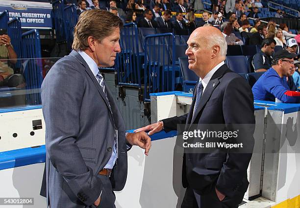 General manager Lou Lamoriello speaks to head coach Mike Babcock of the Toronto Maple Leafs at the 2016 NHL Draft at First Niagara Center on June 25,...