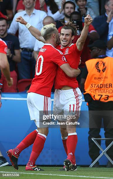 Gareth Bale of Wales celebrates Wales' winning goal with Aaron Ramsey and teammates during the UEFA EURO 2016 round of 16 match between Wales and...