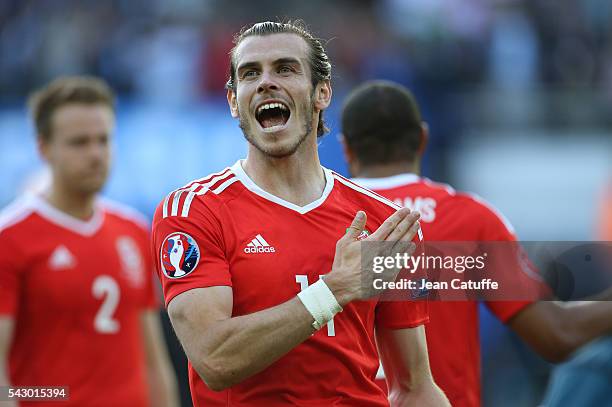 Gareth Bale of Wales celebrates the victory following the UEFA EURO 2016 round of 16 match between Wales and Northern Ireland at Parc des Princes on...