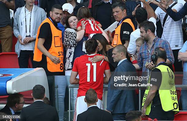 Gareth Bale of Wales meets his wife Emma Rhys-Jones and their daughter Alba Bale following the UEFA EURO 2016 round of 16 match between Wales and...