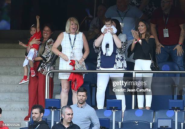 Emma Rhys-Jones, wife of Gareth Bale and their daughters Alba Bale and baby Nava Bale celebrate the victory at the final whistle during the UEFA EURO...