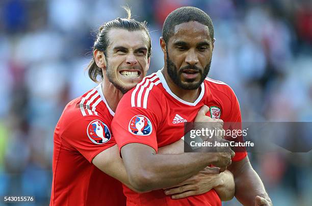 Gareth Bale and Ashley Williams of Wales celebrate the victory following the UEFA EURO 2016 round of 16 match between Wales and Northern Ireland at...