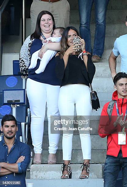 Emma Rhys-Jones, wife of Gareth Bale and their baby daughter Nava Bale celebrate the victory at the final whistle during the UEFA EURO 2016 round of...