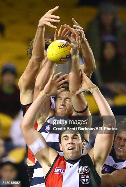 Tom Hickey of the Saints, Paddy McCartin of the Saints and Lachie Henderson of the Cats compete for the ball during the round 14 AFL match between...
