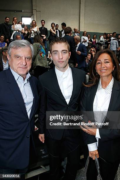 Actor Robert Pattinson standing between CEO Dior Sidney Toledano and his wife Katia attend the Dior Homme Menswear Spring/Summer 2017 show as part of...
