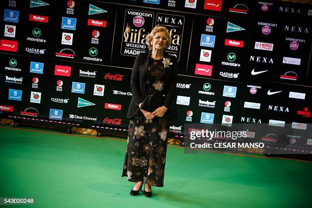 Mayor of Madrid Manuela Carmena poses on the green carpet few moments before the 17th edition of IIFA Awards in Madrid on June 25, 2016. The IIFA...