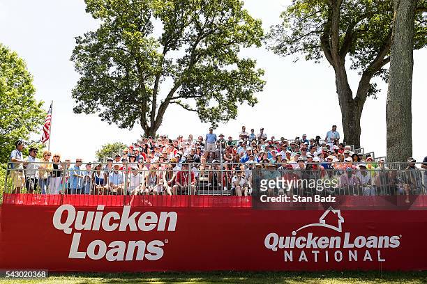 Fans sit in the grandstand on the first hole tee box during the third round of the Quicken Loans National at Congressional Country Club on June 25,...