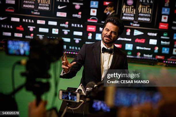 Indian Bollywood actor Anil Kapoor poses on the green carpet few moments before the 17th edition of IIFA Awards in Madrid on June 25, 2016. The IIFA...