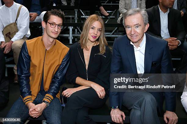 Actors Pierre Niney, Natasha Andrews and Owner of LVMH Luxury Group Bernard Arnault attend the Dior Homme Menswear Spring/Summer 2017 show as part of...
