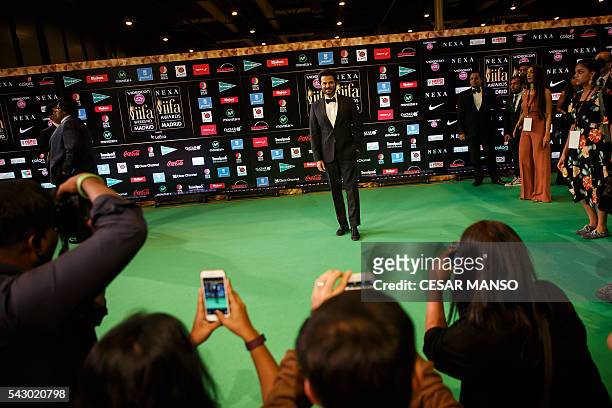 Indian Bollywood actor Anil Kapoor poses on the green carpet few moments before the 17th edition of IIFA Awards in Madrid on June 25, 2016. The IIFA...