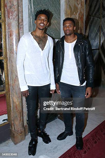 Basket-Ball player Nick Young and American Football player Brice Butler attend the Balmain Menswear Spring/Summer 2017 show as part of Paris Fashion...