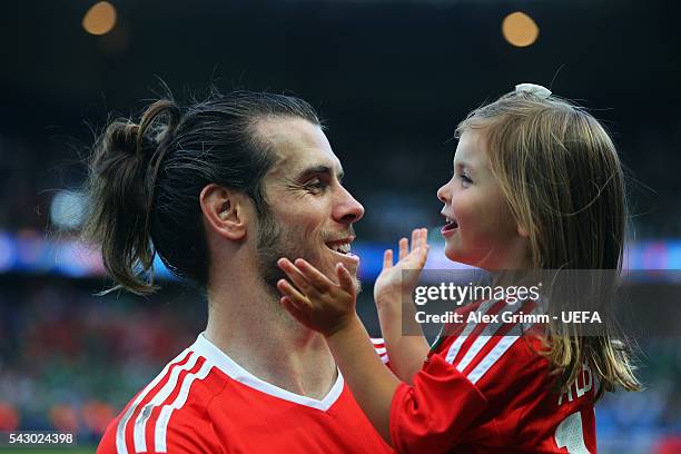 Gareth Bale of Wales celebrates his team's win with his daughter Alba Violet after the UEFA EURO 2016 round of 16 match between Wales and Northern...