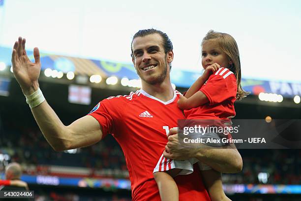 Gareth Bale of Wales celebrates his team's win with his daughter Alba Violet after the UEFA EURO 2016 round of 16 match between Wales and Northern...