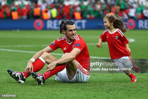 Gareth Bale of Wales celebrates his team's win with his daughter Alba Violet after the UEFA EURO 2016 round of 16 match between Wales and Northern...