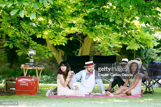 Katie Acuesa, Ryan King, Kyle Hirlehey and Arti Sharma enjoy a picnic on the grounds. Gatsby Garden Party is a revival event at the Spadina Museum...