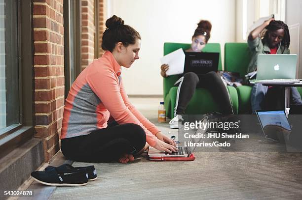 Students on their laptops study in the Brody Learning Commons, a study space and library on the Homewood campus of Johns Hopkins University in...