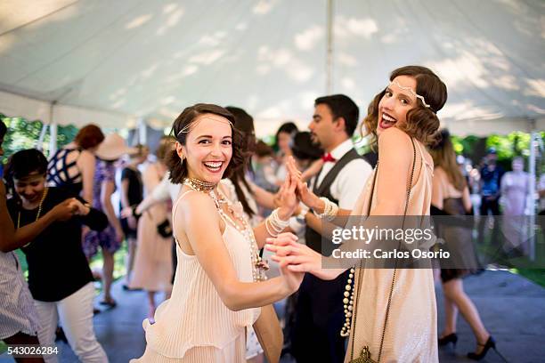 Arianna Benincasa and Leah Benincasa pose for a photo while dancing. Gatsby Garden Party is a revival event at the Spadina Museum based on Scott...