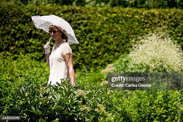 Woman strolls through the garden. Gatsby Garden Party is a revival event at the Spadina Museum based on Scott Fitzgeralds novel The Great Gatsby with...