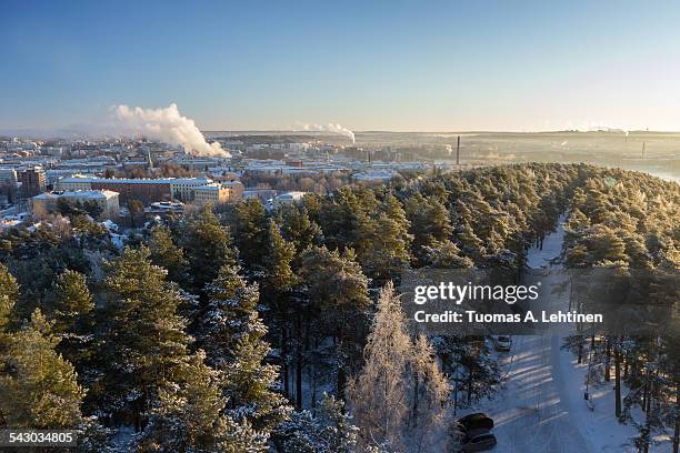 view over tampere city and snowy trees in pyynikki - tampere stock pictures, royalty-free photos & images