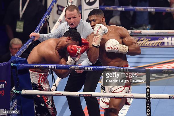 Anthony Joshua in boxing action with Dominic Breazeale during the IBF World Heavyweight Title fight at The O2 Arena on June 25, 2016 in London,...