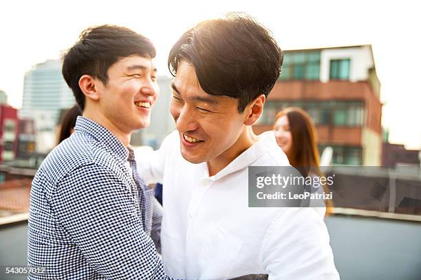 friends meeting and party on seoul rooftop, south korea - korean people stock pictures, royalty-free photos & images