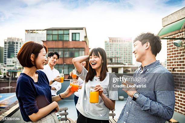 korean people having rooftop party in seoul - juice drink stock pictures, royalty-free photos & images