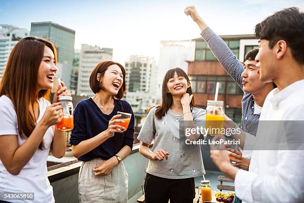 korean people having rooftop party in seoul - jb of south korean stockfoto's en -beelden