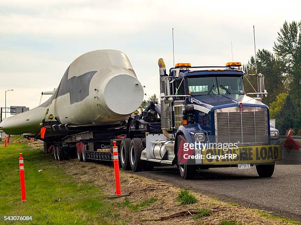 truck with oversize load sign carring b-1 bomber i-5 oregon - bomber plane stock pictures, royalty-free photos & images