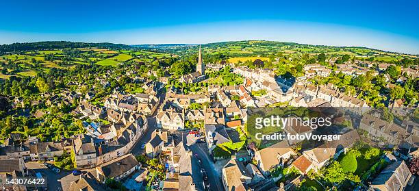 aerial panorama over idyllic country village cottages patchwork summer landscape - gloucestershire stock pictures, royalty-free photos & images