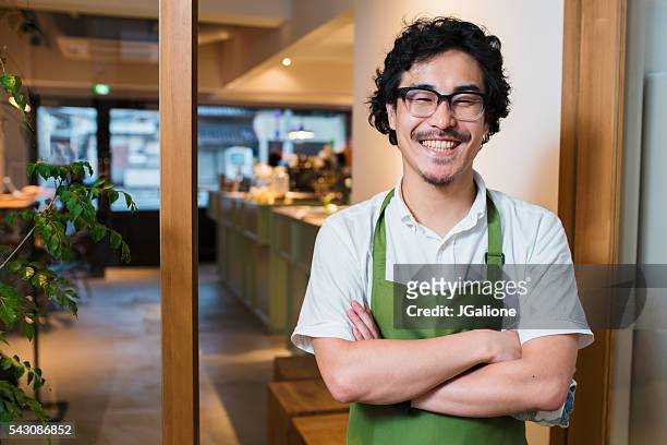 portrait of a barista in an apron - assistant bildbanksfoton och bilder