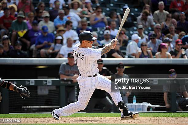 Brandon Barnes of the Colorado Rockies gets a base hit in the sixth inning against the Arizona Diamondbacks at Coors Field on June 25, 2016 in...